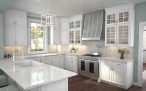 Modern white kitchen with stainless steel appliances.