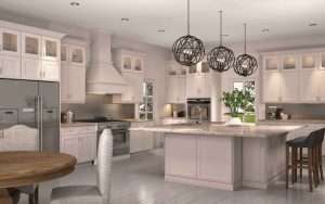 Modern kitchen with island and globe lights.
