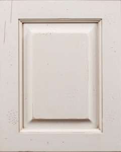 Distressed white cabinet door, classic design.