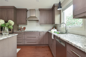 Modern kitchen with wooden cabinets and granite countertops.