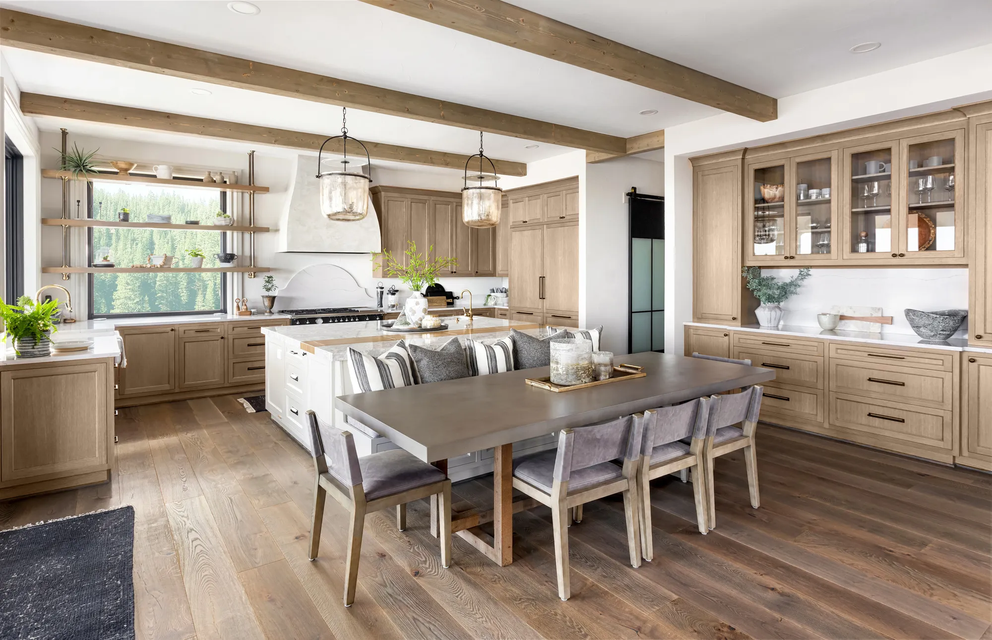 Modern kitchen with wooden cabinets and dining area.